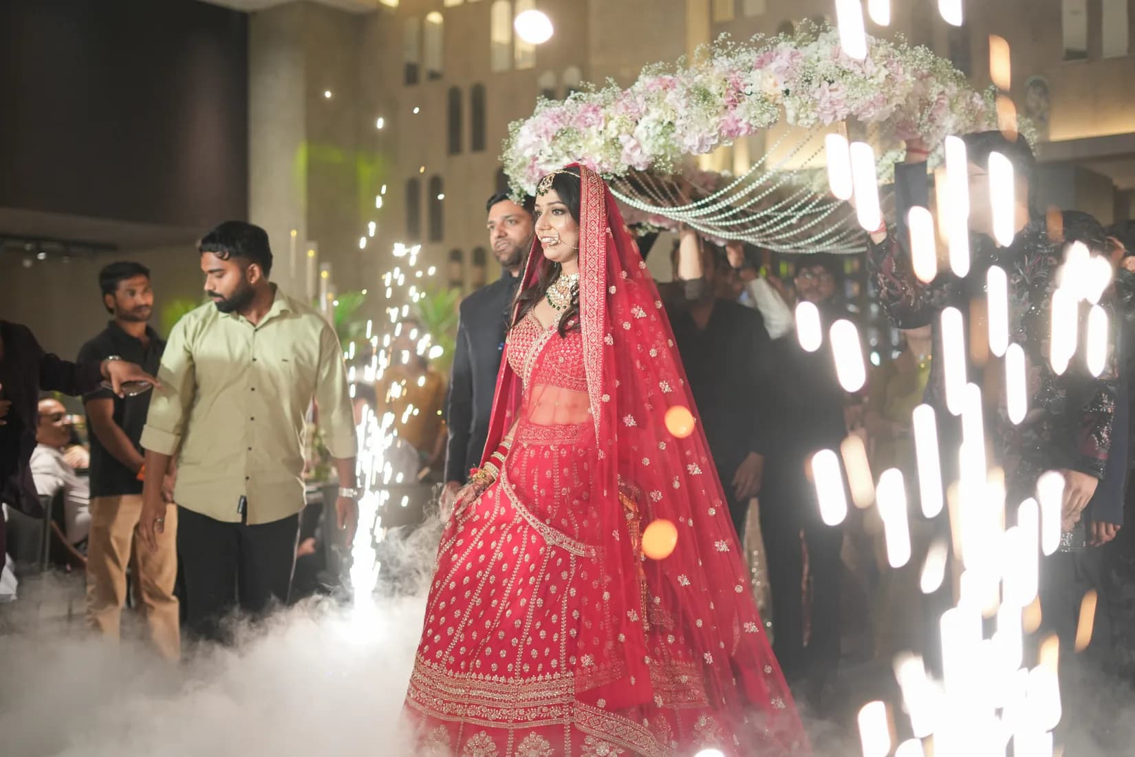 Marwari bride in vibrant lehenga and layered gold jewellery during wedding ritual