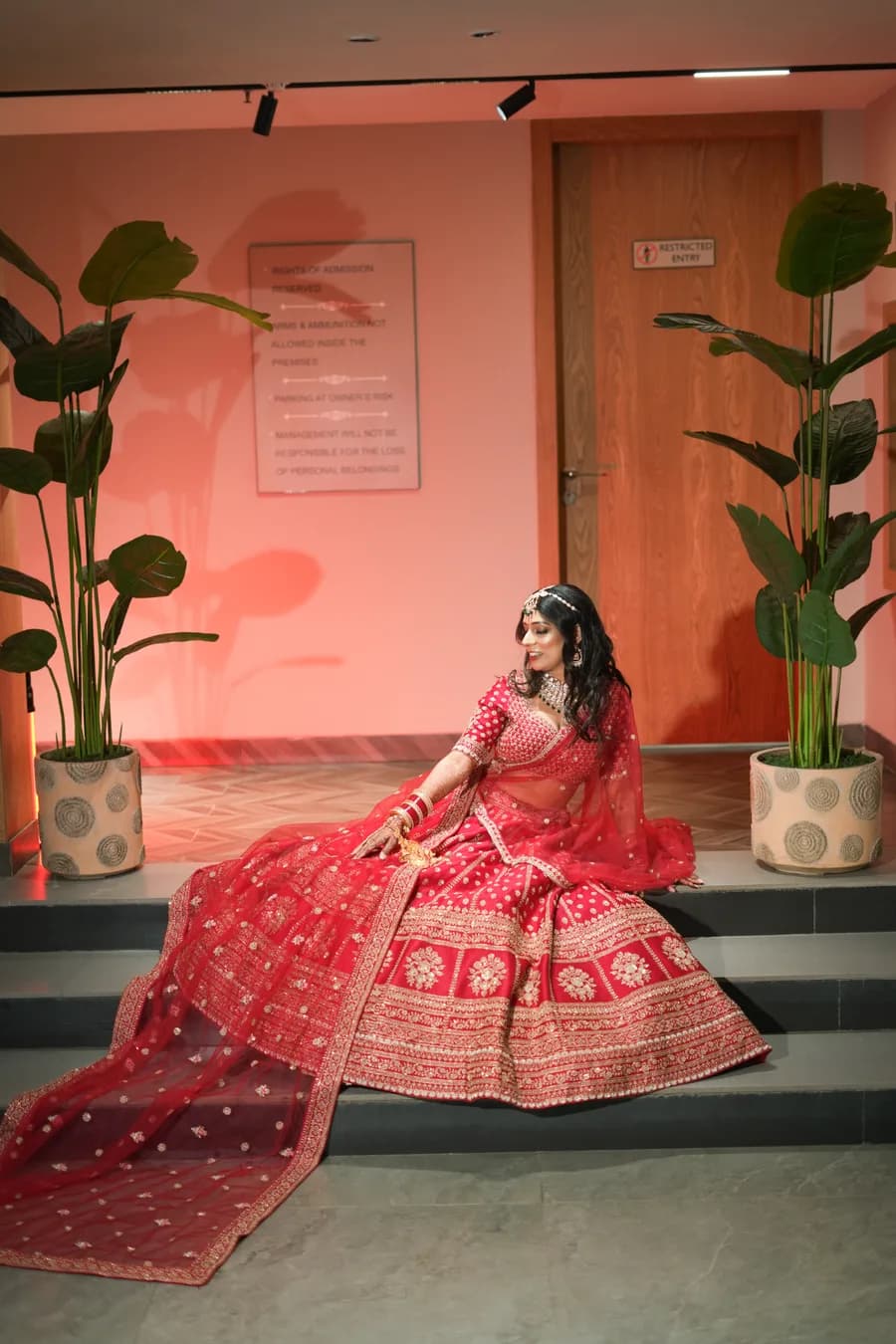 Gujarati bride dancing in yellow lehenga and mirror-work at wedding celebration