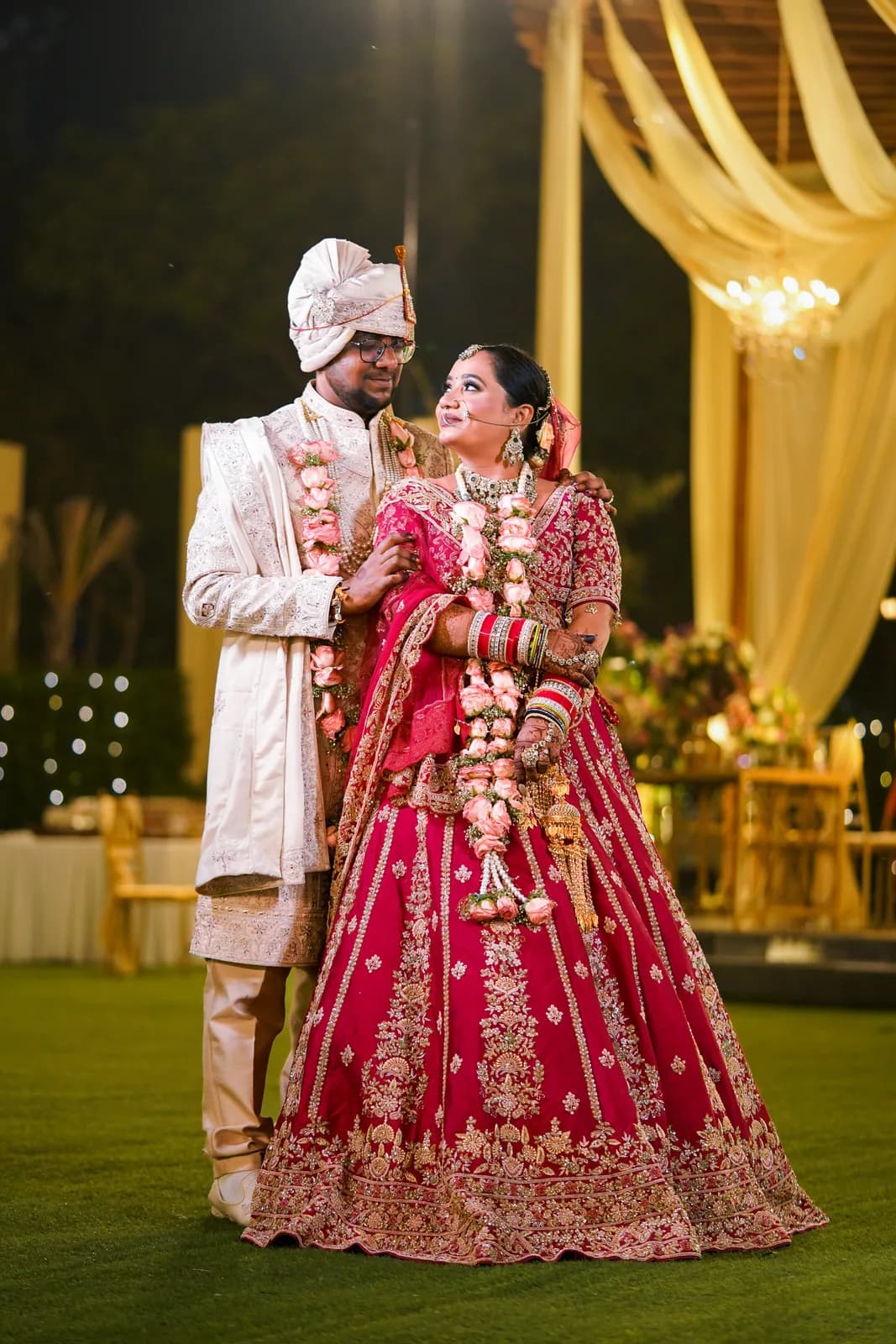 Groom carrying the bride in a joyful wedding moment — Lens9 Studio, New Delhi