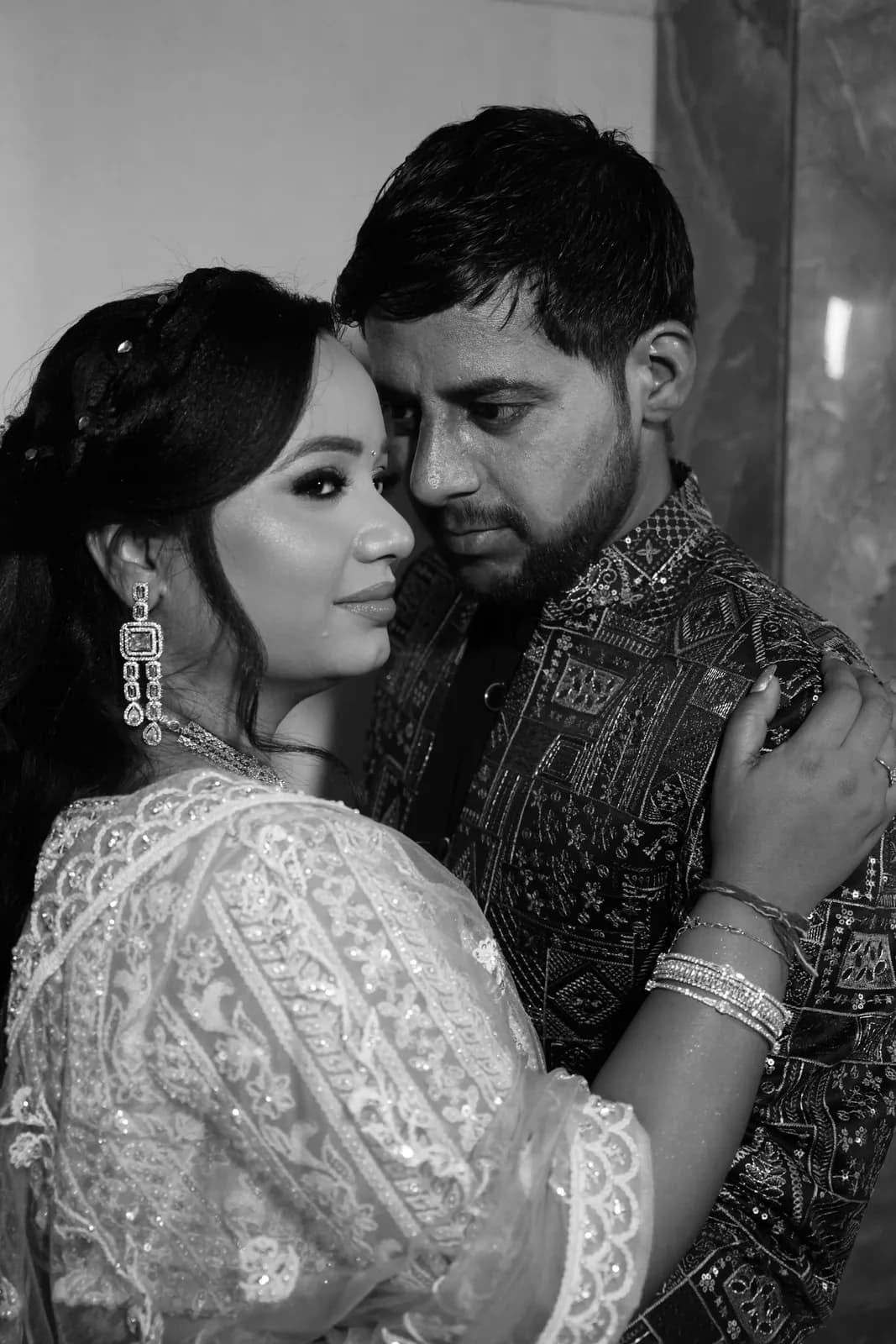 Black-and-white candid wedding portrait of a couple — Lens9 Studio, New Delhi