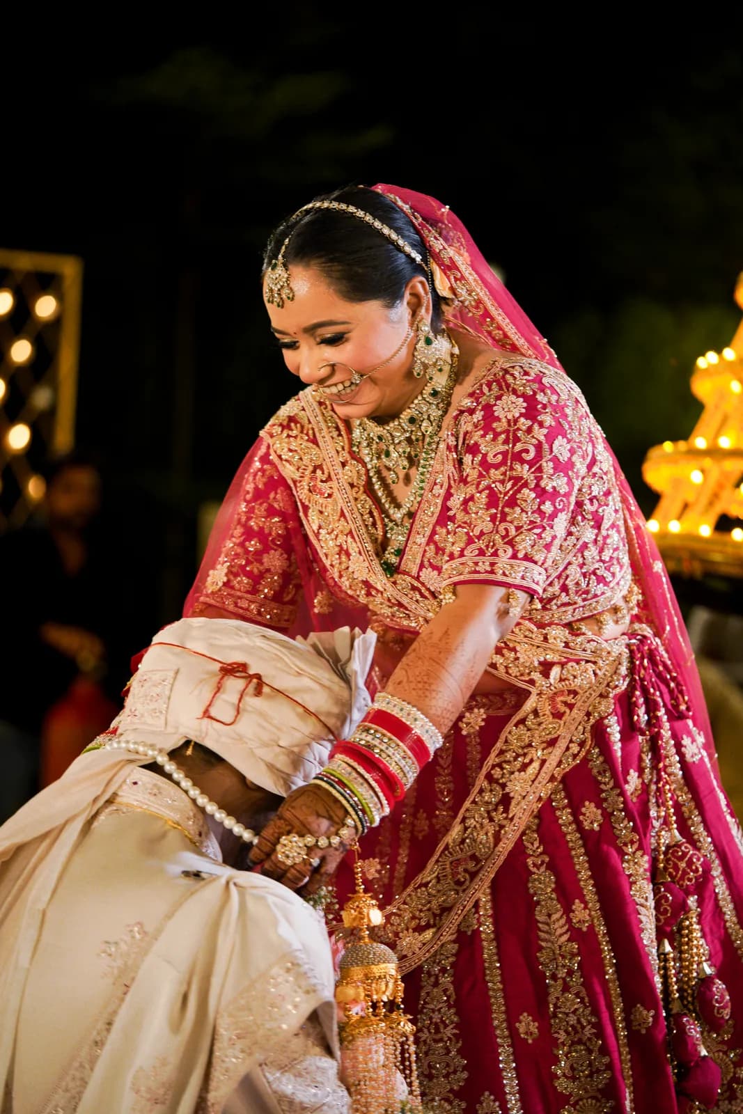 Bride in a red lehenga, dramatic bridal portrait by Lens9 Studio, New Delhi