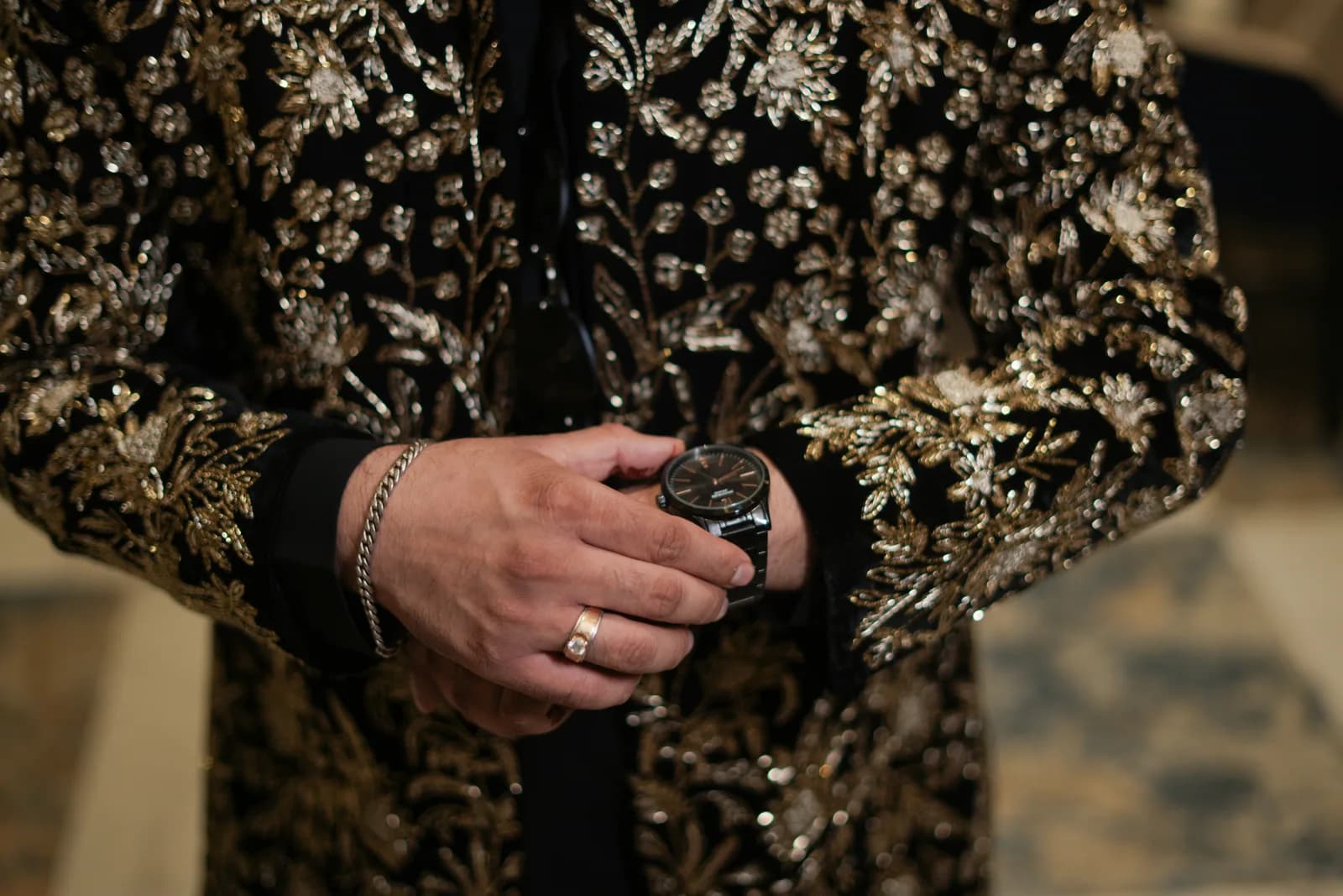 Detailed close-up of bride's jewelry and dupatta with ceremony details at a traditional Indian wedding celebration.